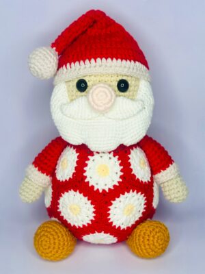 haakpatroon: kerstman met afrikaanse bloemen